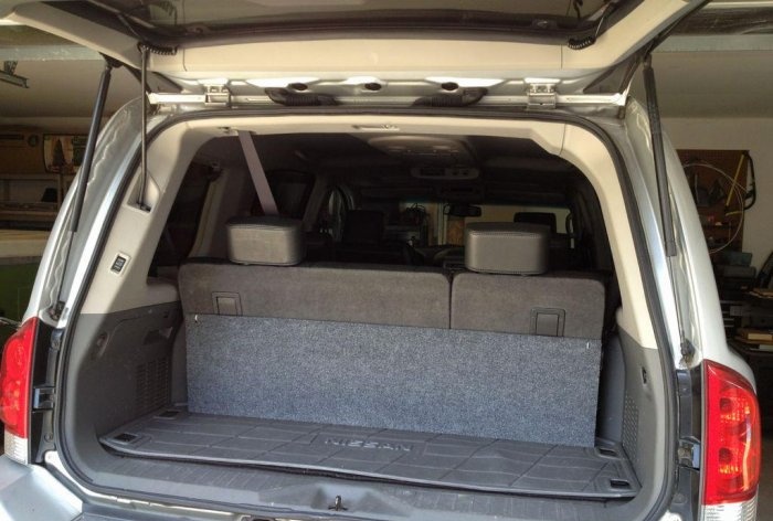 Convenient folding shelf in the trunk of a car