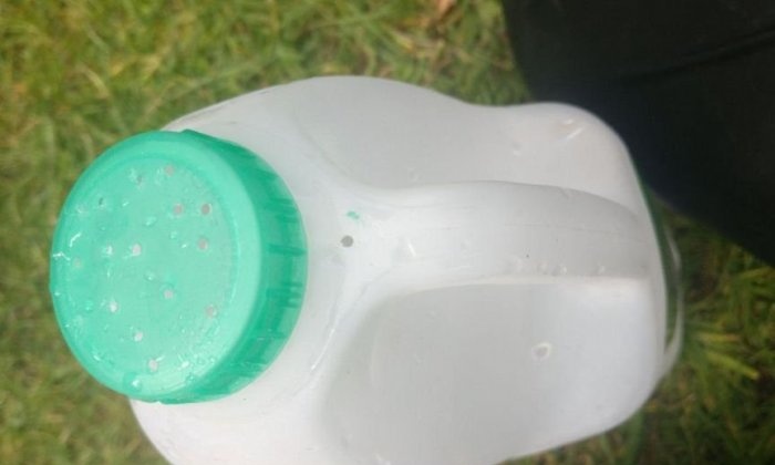 How to make a full-fledged garden watering can from a canister in 2 minutes