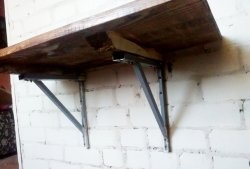 Wooden table with wall mount