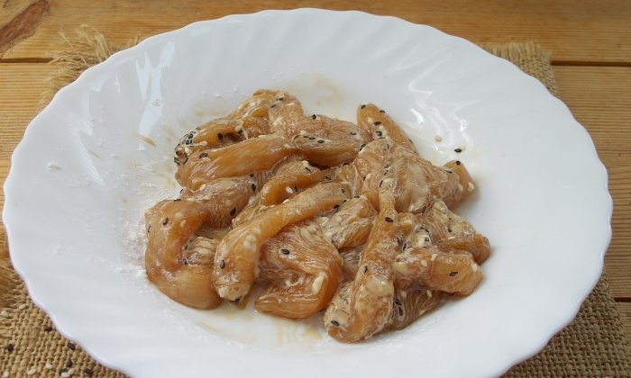 Chicken fillet in soy sauce in a frying pan