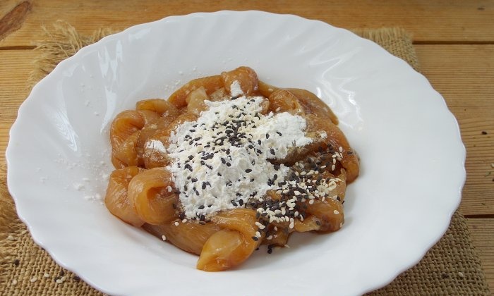 Chicken fillet in soy sauce in a frying pan