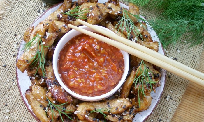 Chicken fillet in soy sauce in a frying pan