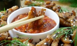 Chicken fillet in soy sauce in a frying pan