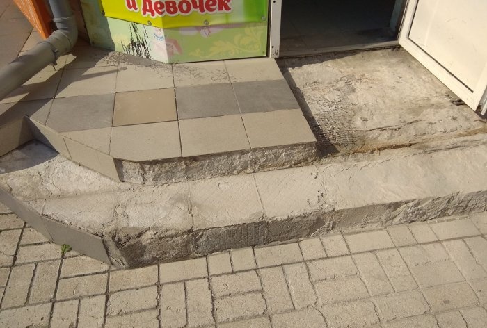 Removing old tiles and laying new tiles on threshold steps