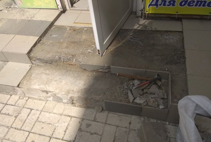 Removing old tiles and laying new tiles on threshold steps