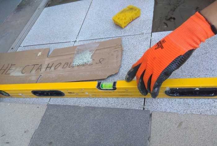 Removing old tiles and laying new tiles on threshold steps