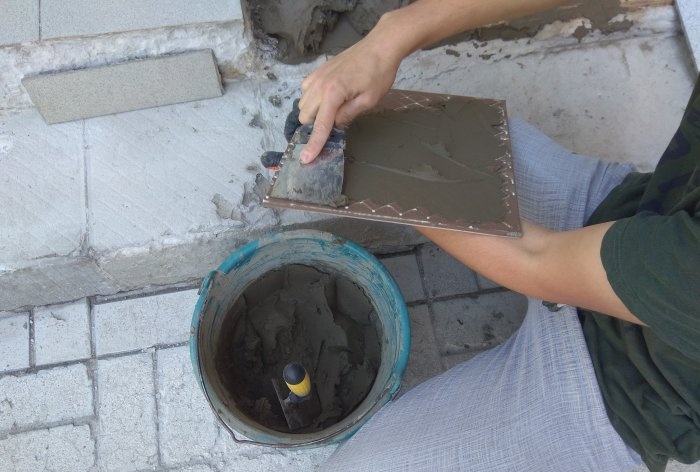 Removing old tiles and laying new tiles on threshold steps