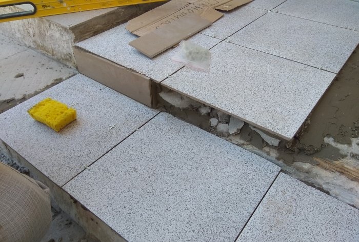 Removing old tiles and laying new tiles on threshold steps