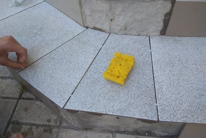 Removing old tiles and laying new tiles on threshold steps