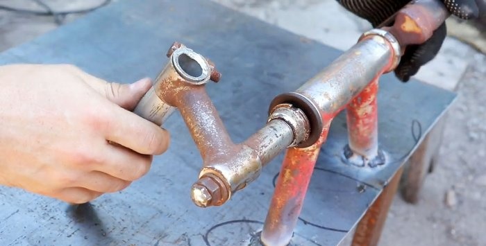 A simple stand for an angle grinder made from a bicycle