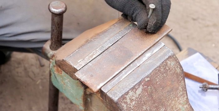 A simple stand for an angle grinder made from a bicycle