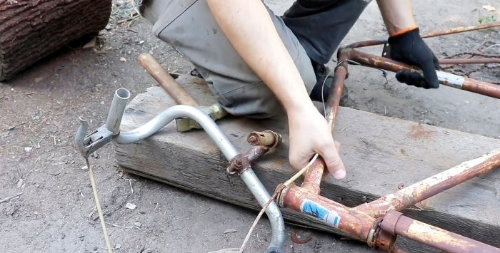 A simple stand for an angle grinder made from a bicycle