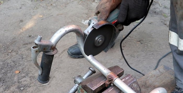 A simple stand for an angle grinder made from a bicycle