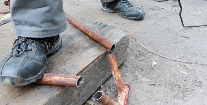 A simple stand for an angle grinder made from a bicycle