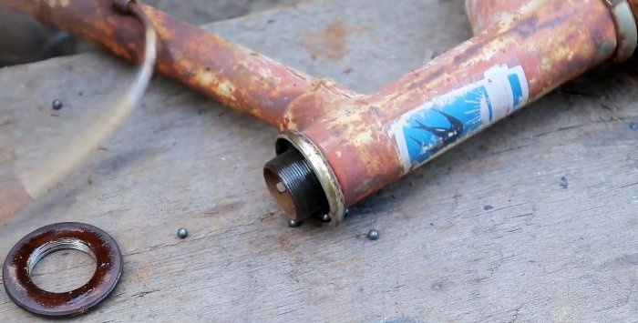 A simple stand for an angle grinder made from a bicycle