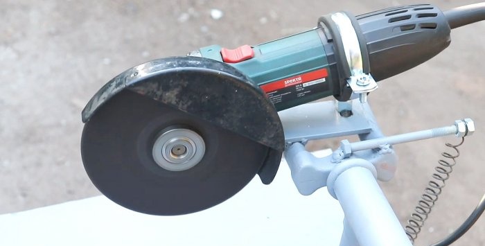 A simple stand for an angle grinder made from a bicycle