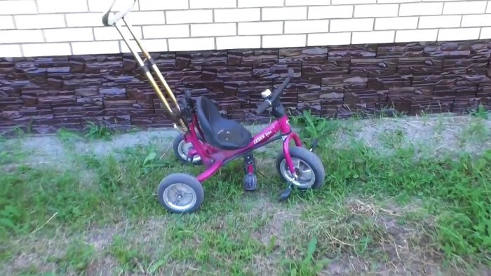 Stand for an angle grinder made from the handle of a children's bicycle