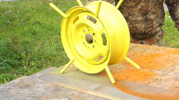 DIY garden hose reel from a car wheel