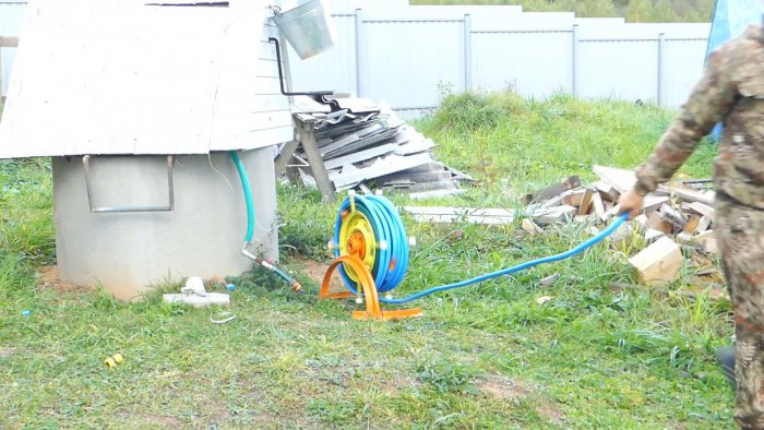 DIY garden hose reel from a car wheel