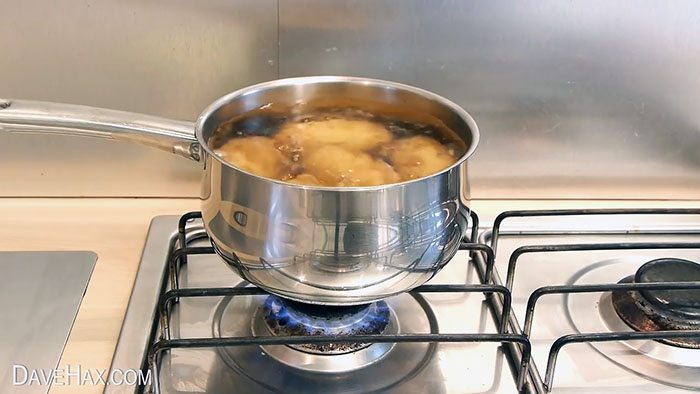 A way to quickly peel potatoes so that the skin peels off on its own