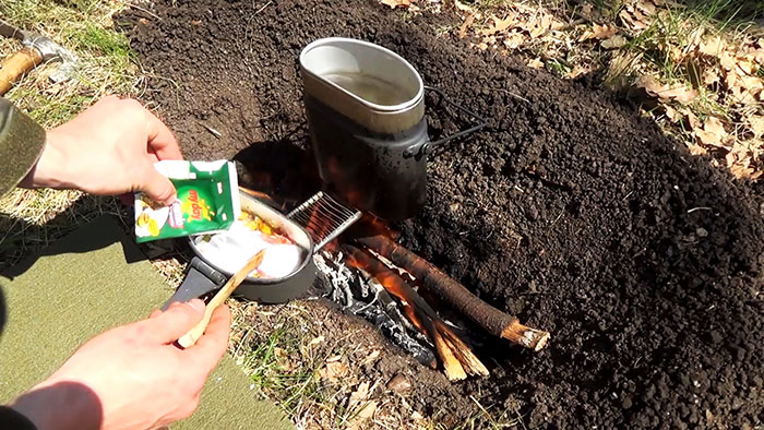 Picnic in nature delicious pasta on the fire