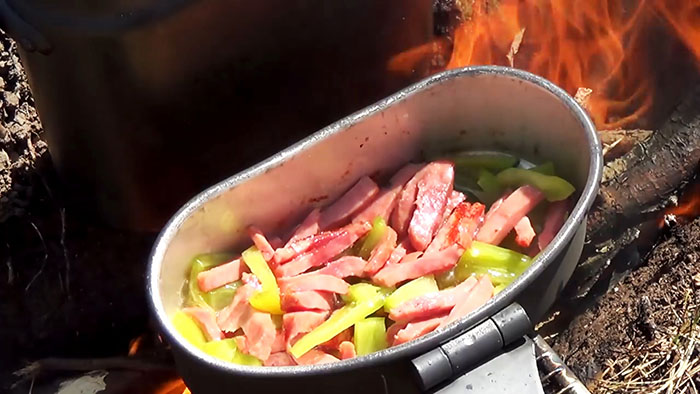 Picnic in nature delicious pasta on the fire