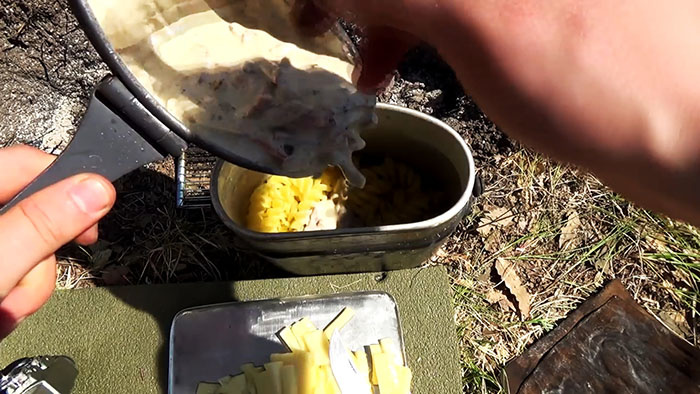 Picnic in nature delicious pasta on the fire