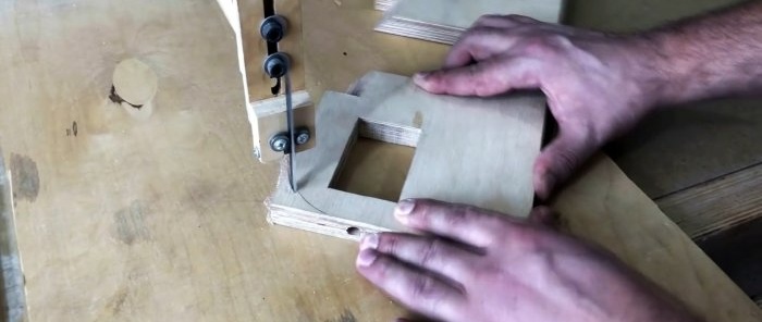 Homemade hand-held plywood band saw driven by a screwdriver