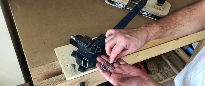 Homemade hand-held plywood band saw driven by a screwdriver