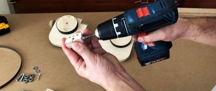 Homemade hand-held plywood band saw driven by a screwdriver