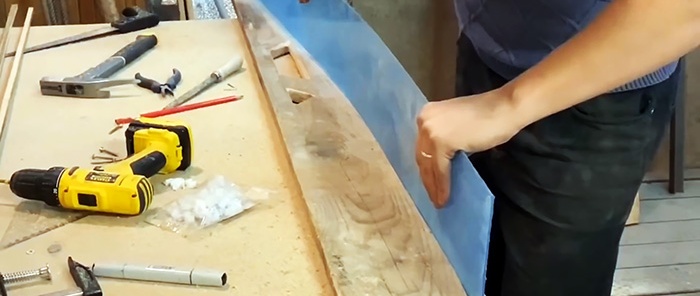 How to make a door to a bathhouse of an interesting design from old boards