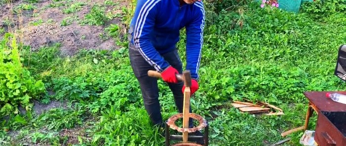 Stand for splitting firewood with a hammer from an old car wheel