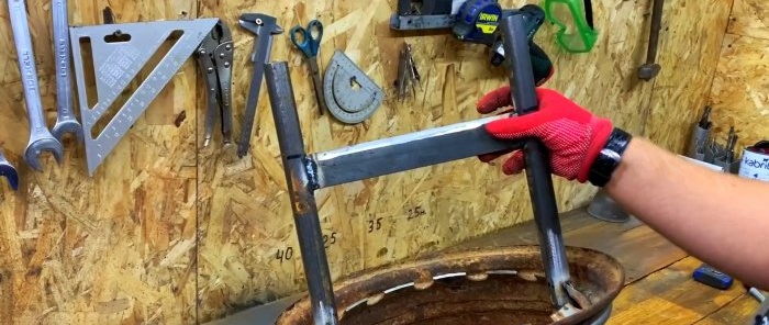 Stand for splitting firewood with a hammer from an old car wheel