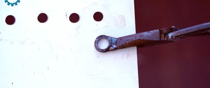 Manual hole punch for tin from broken pliers