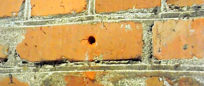 An old-fashioned way to make a hole without a hammer drill