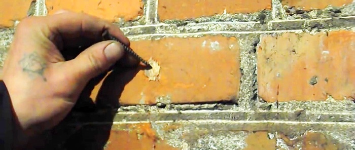 An old-fashioned way to make a hole without a hammer drill