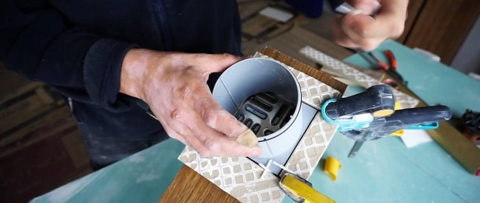 How to use a grinder to make a perfectly even square hole in a tile