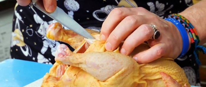 Cut out the frame from the inside of the chicken from the tail side