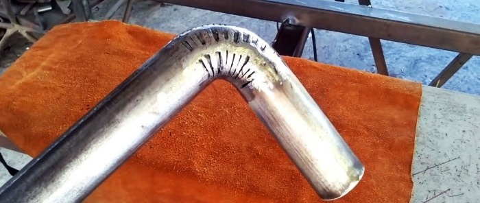 An unusual way to make a perfect right-angle bend in a round pipe without a pipe bender