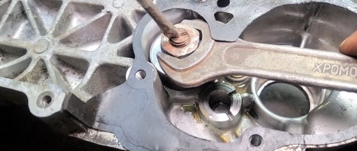 hold the bolt with a screwdriver and tighten the nut