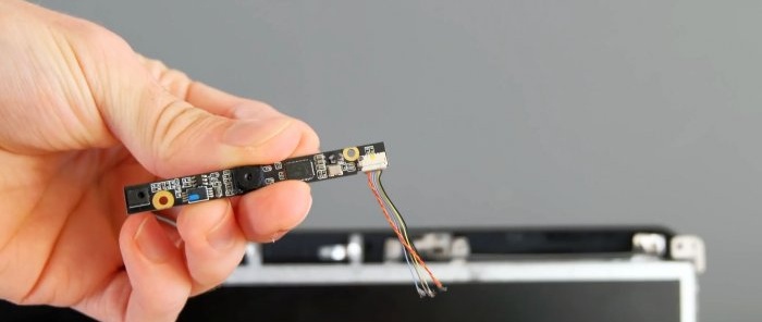 Unscrew the webcam and carefully cut off the wires