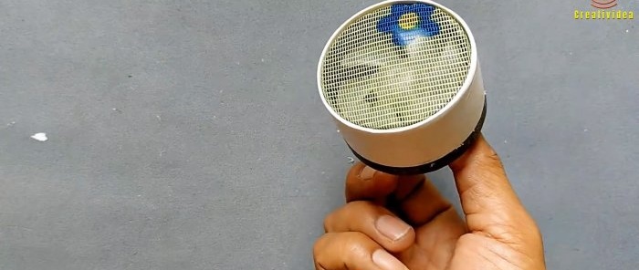 A mesh fabric is stretched over the diffuser of the hair dryer fan