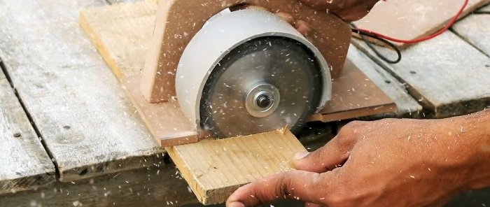 A homemade circular saw saws a board