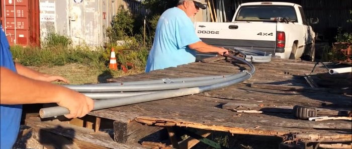 How to bend a pipe into a greenhouse arch using a homemade template