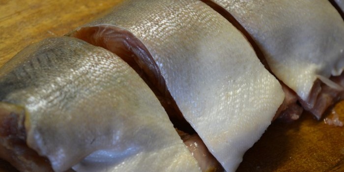 Homemade canning of pink salmon in a pressure cooker