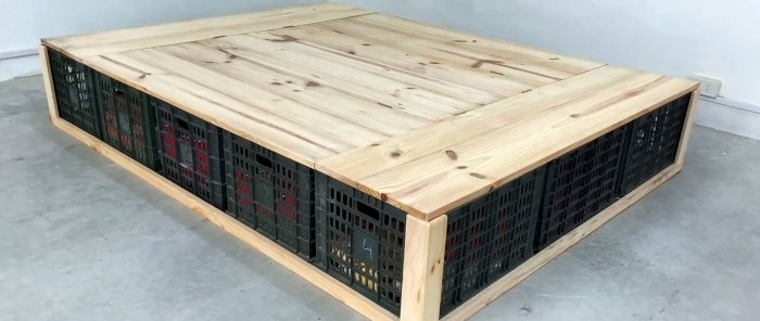 Bed made of plastic vegetable crates with numerous storage spaces