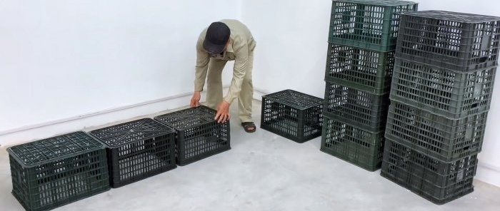 Bed made of plastic vegetable crates with numerous storage spaces