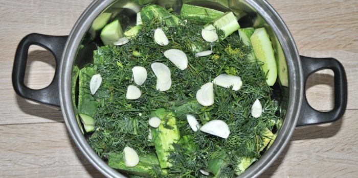 Instant lightly salted cucumbers in a saucepan