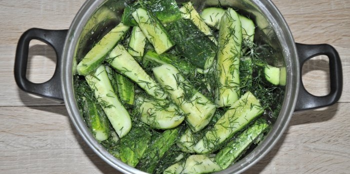 Instant lightly salted cucumbers in a saucepan