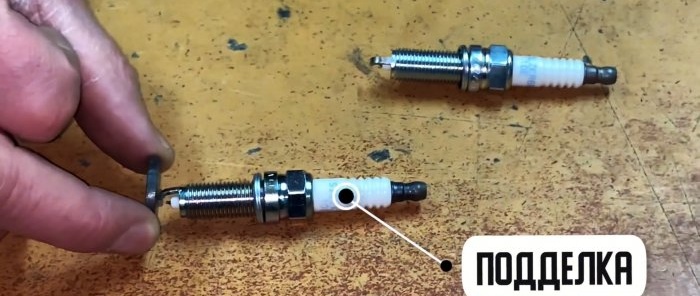 How to distinguish an original platinum or iridium spark plug from a fake using a magnet